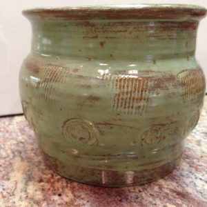 green and brown vase from Clay By Kim Pottery in Fort Walton Beach